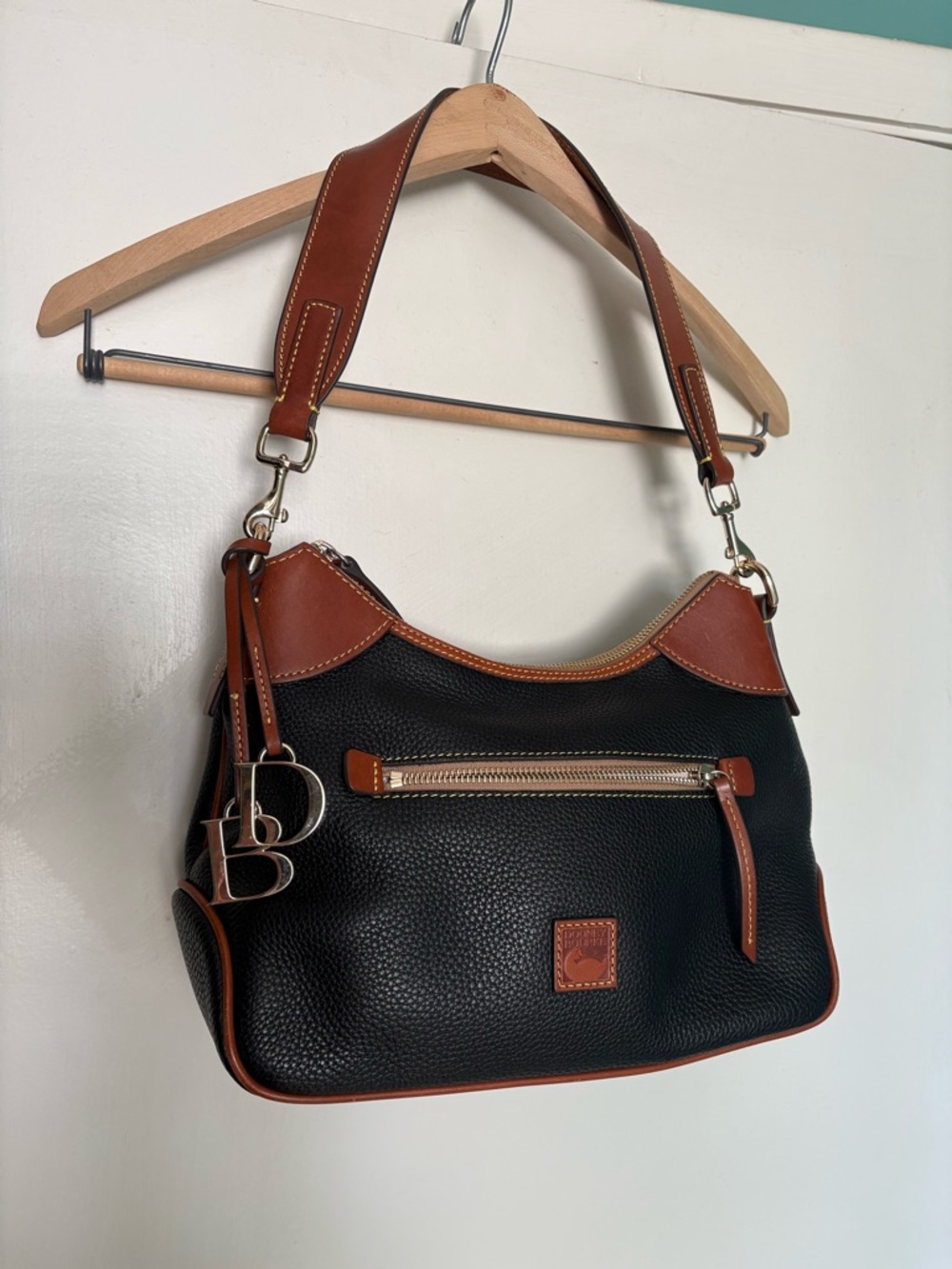 Dooney & Bourke Black Pebbled Leather Shoulder Bag with Brown Trim